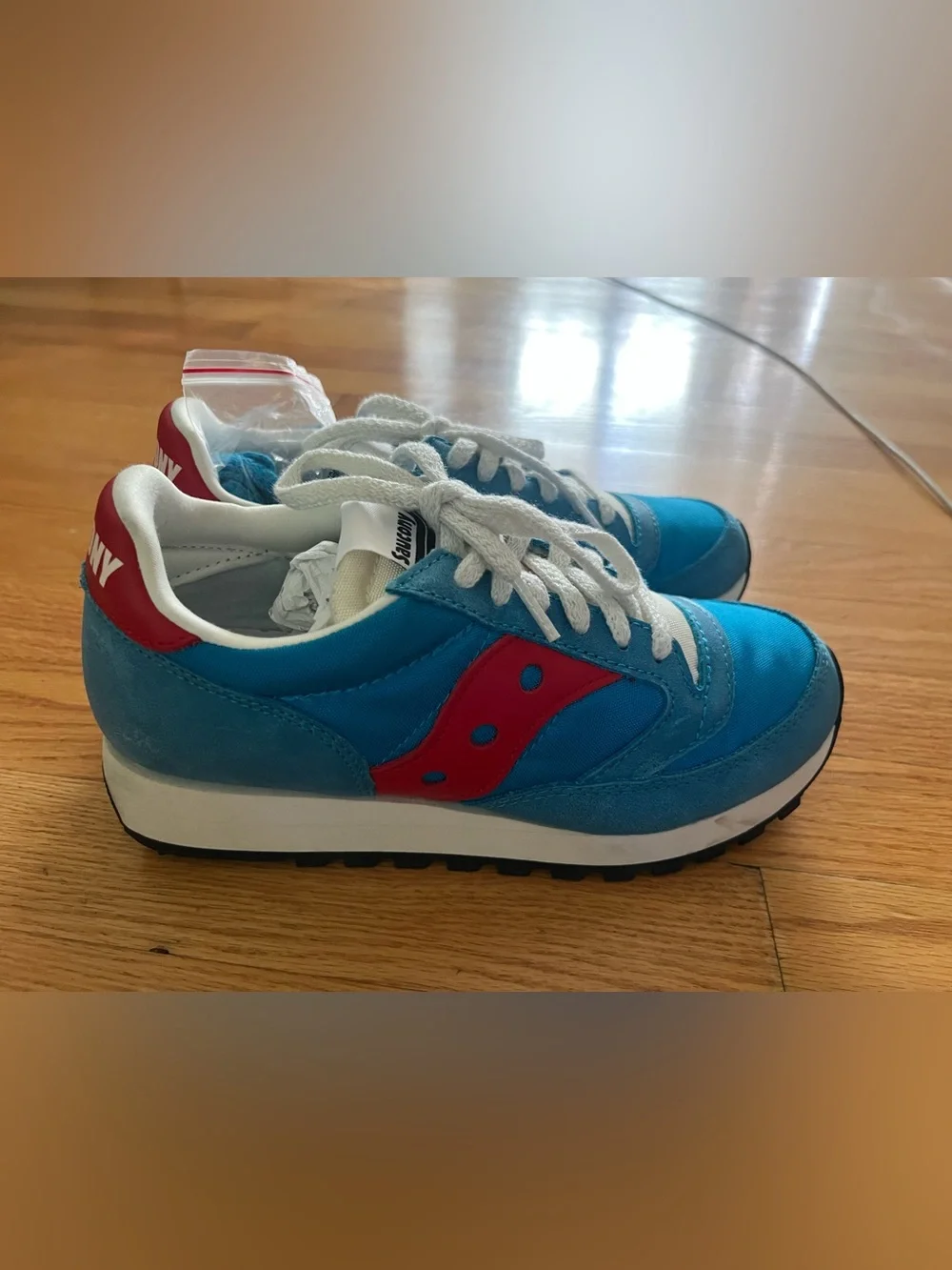 the Saucony Jazz 81 sneakers in the vibrant blue and red